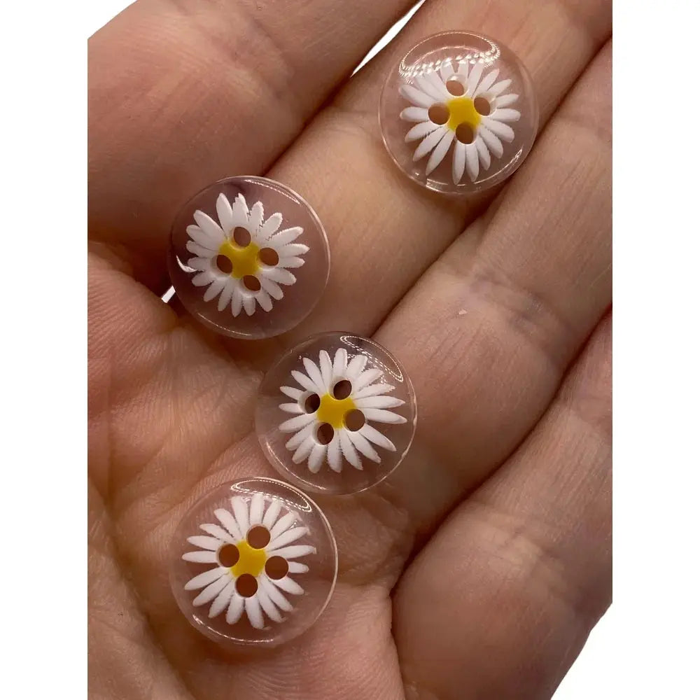 Daisy-themed clear plastic buttons.