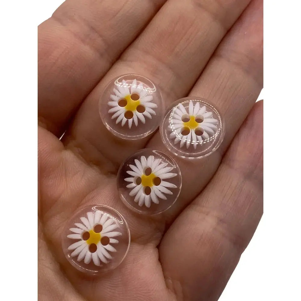 Daisy-themed clear buttons.