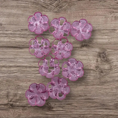 Translucent pink flower-shaped buttons.