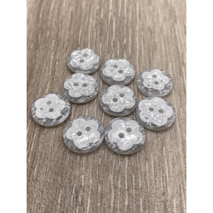 Ten flower-shaped buttons.