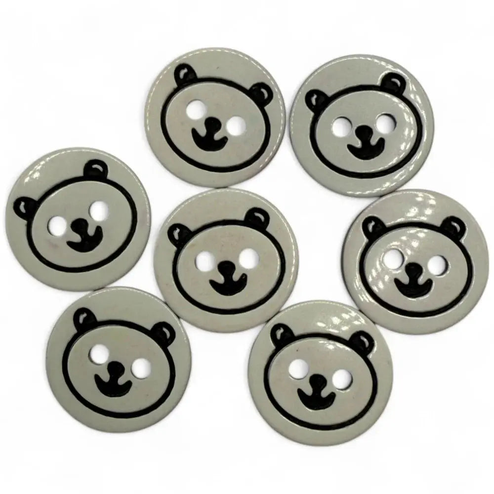 Seven gray bear-faced buttons.