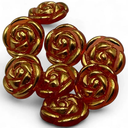 Rose-shaped, amber-colored buttons with gold accents.