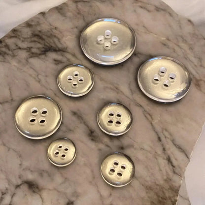 Seven silver buttons.