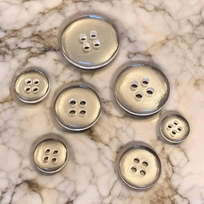 Assorted silver buttons.