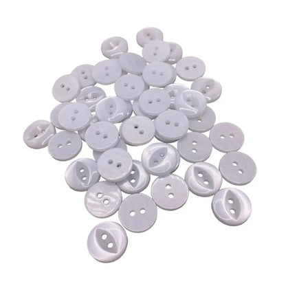 Pile of white two-hole buttons.