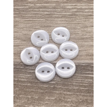 Seven white, two-hole buttons.