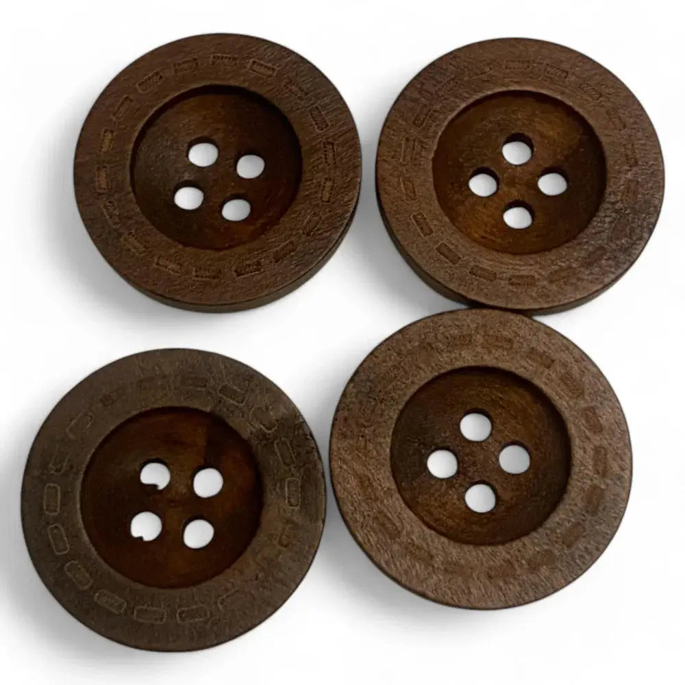 Four brown wooden buttons.