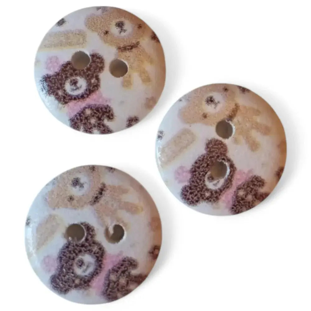 Three teddy bear patterned buttons.