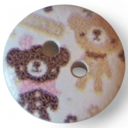 Round button with teddy bear design.