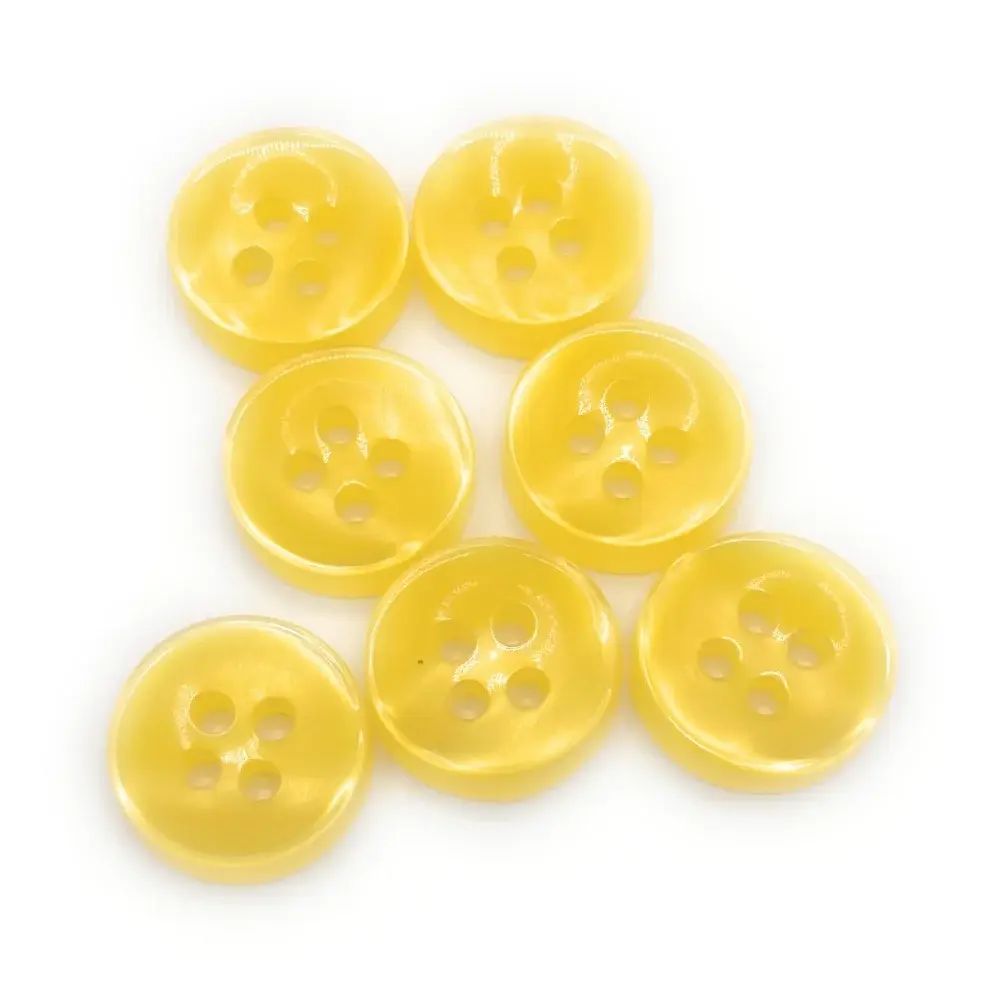 Seven yellow four-hole buttons.