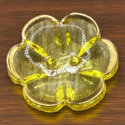 KnitForLess yellow flower-shaped acrylic button with a gold rim and two holes for sewing projects
