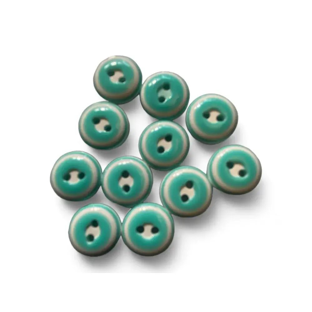 Teal and white two-hole buttons.