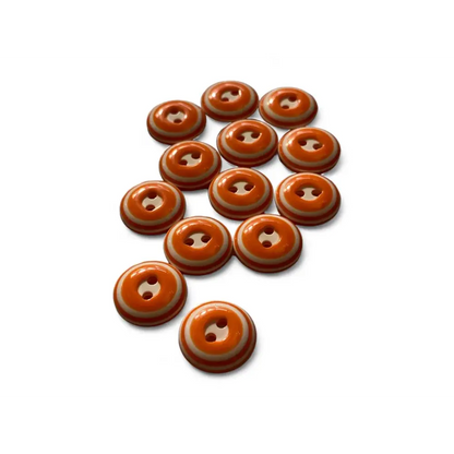 Orange and white striped buttons.