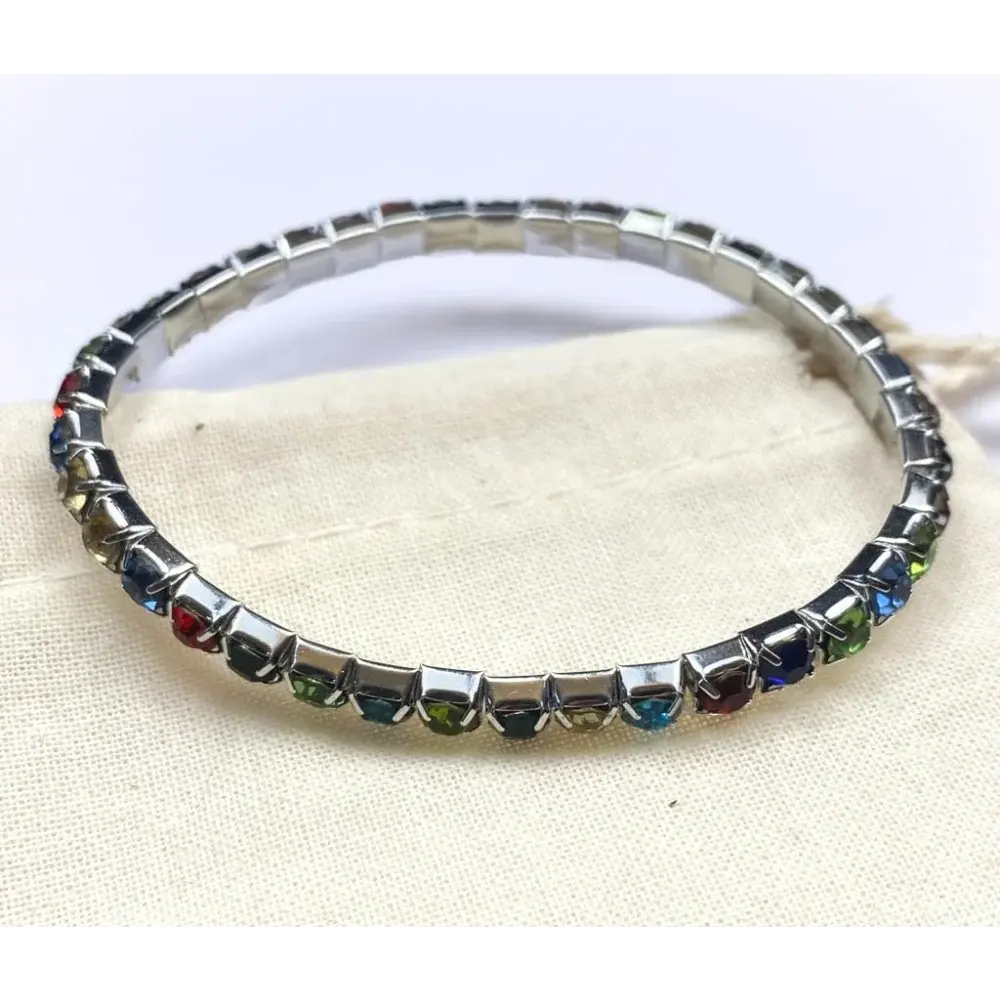 Silver bracelet with colorful gemstones.